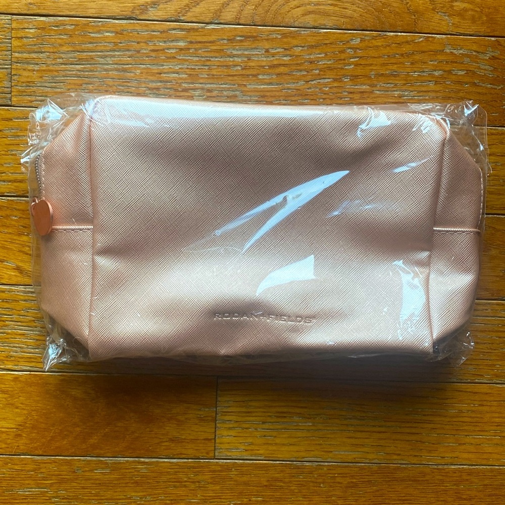 Peachy Pink Rodan+Fields unopened Cosmetic Bag.